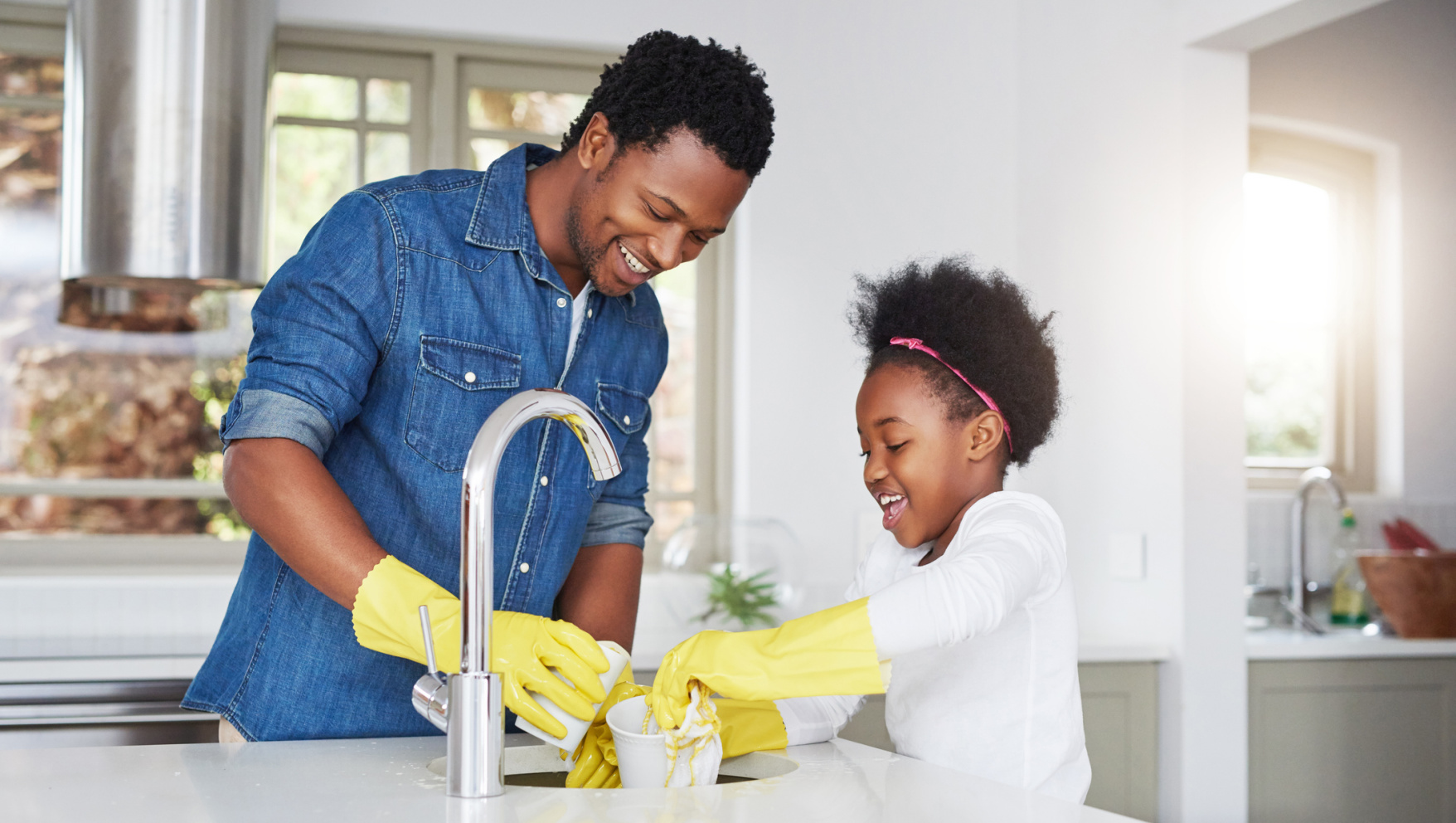 A parent supporting a child as they learn everyday household responsibilities, symbolizing guidance, independence, and preparation for school life. A parent guiding a child through simple household tasks, helping build independence and responsibility before starting school